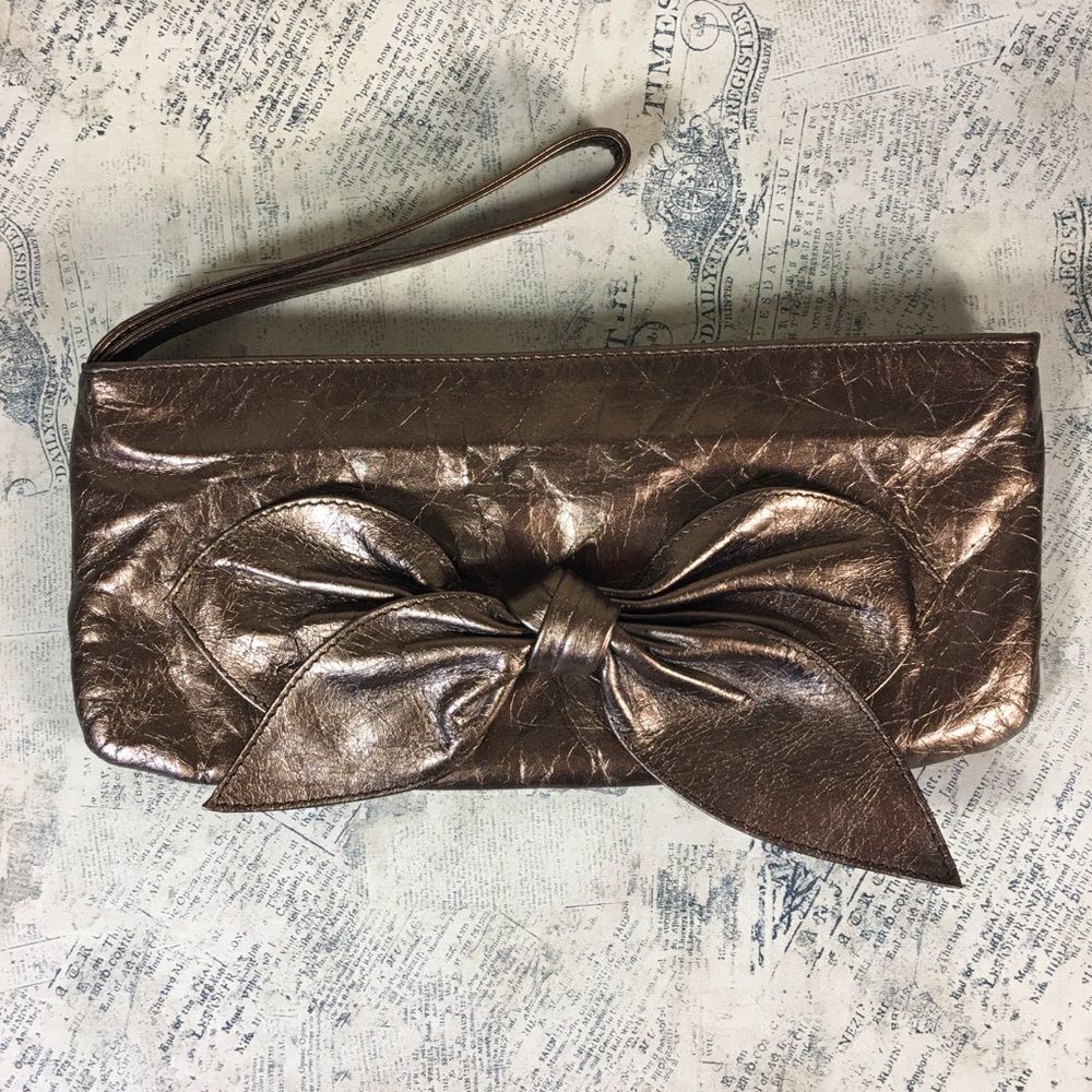 HOBO  Bronze bow top zip wristlet
